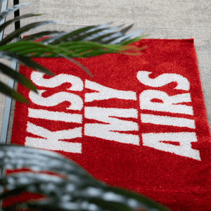 a red rug with white text on it