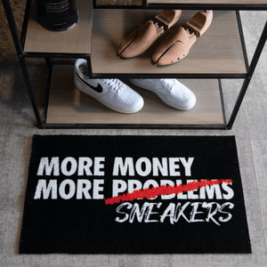 a shoe rack with shoes and a rug