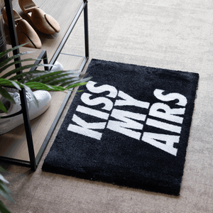 a black and white rug with white text on it