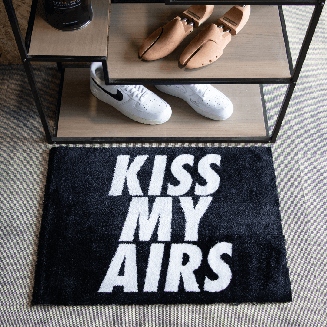 a black and white rug with white text on it