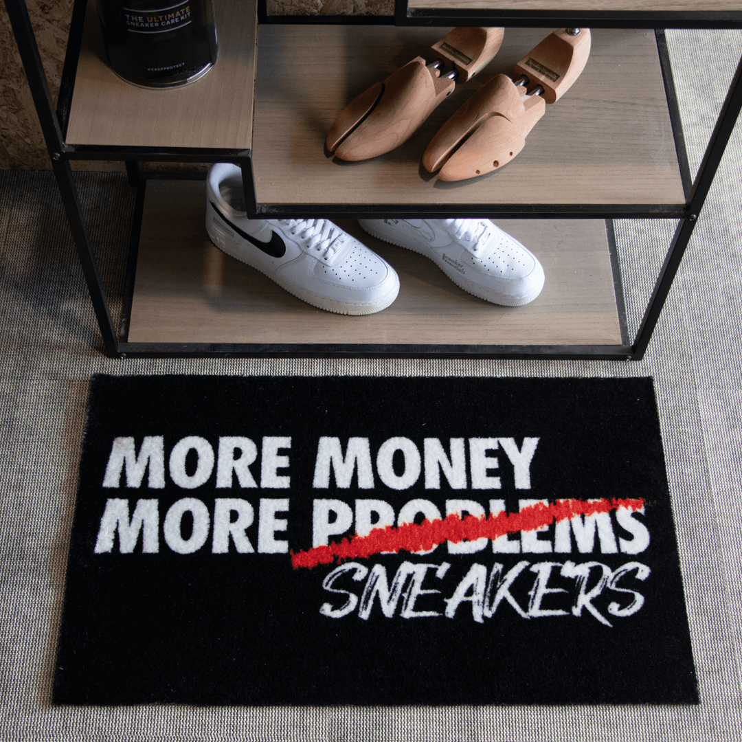 a shoe rack with shoes and a rug
